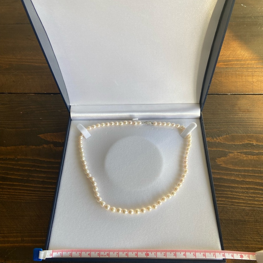 Authentic pearl necklace in original box.